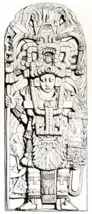 Fig.11 Stela A, Piedras Negras. The headdress worn by this personage represents the open jaws of a jaguar from which a small human head emerges. After Spinden 1957: fig. L.